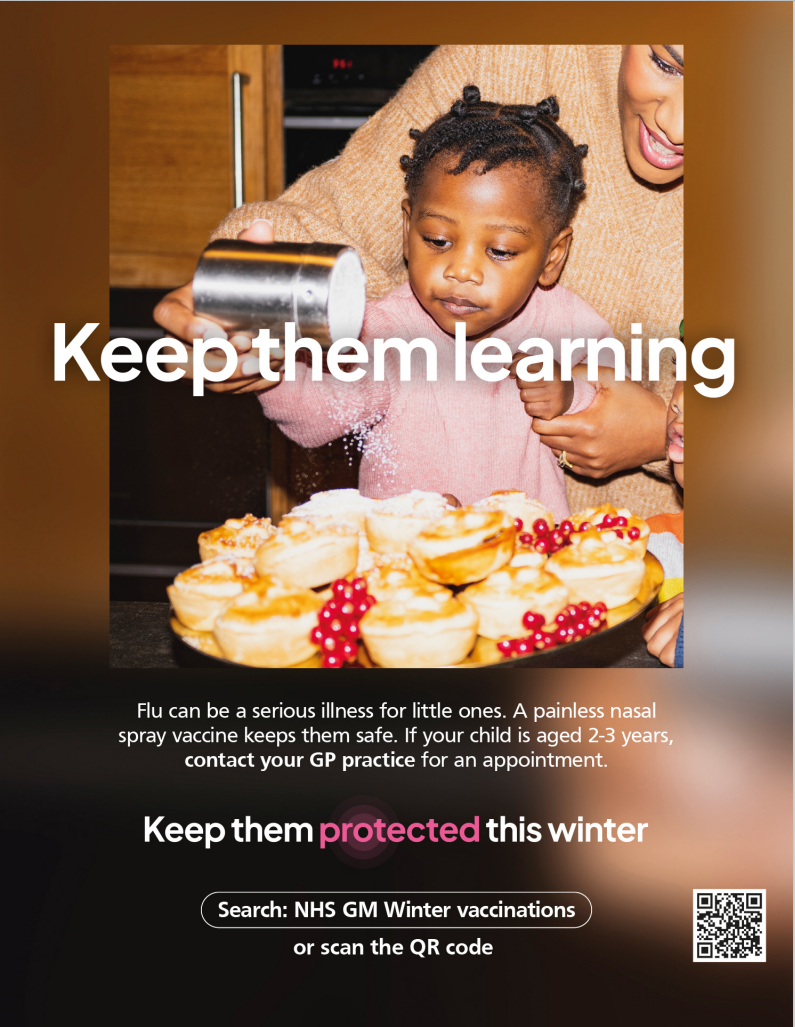 Small child being helped to sprinkle powdered sugar over cakes.